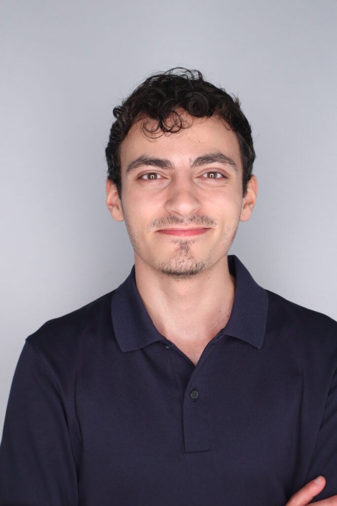 Santino Diaz-Palma, a man with a light skin tone, smiling straight ahead